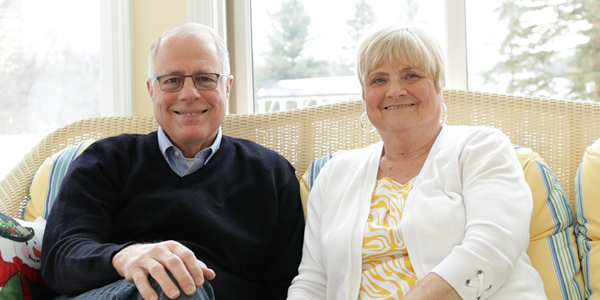 elderly man and woman smiling